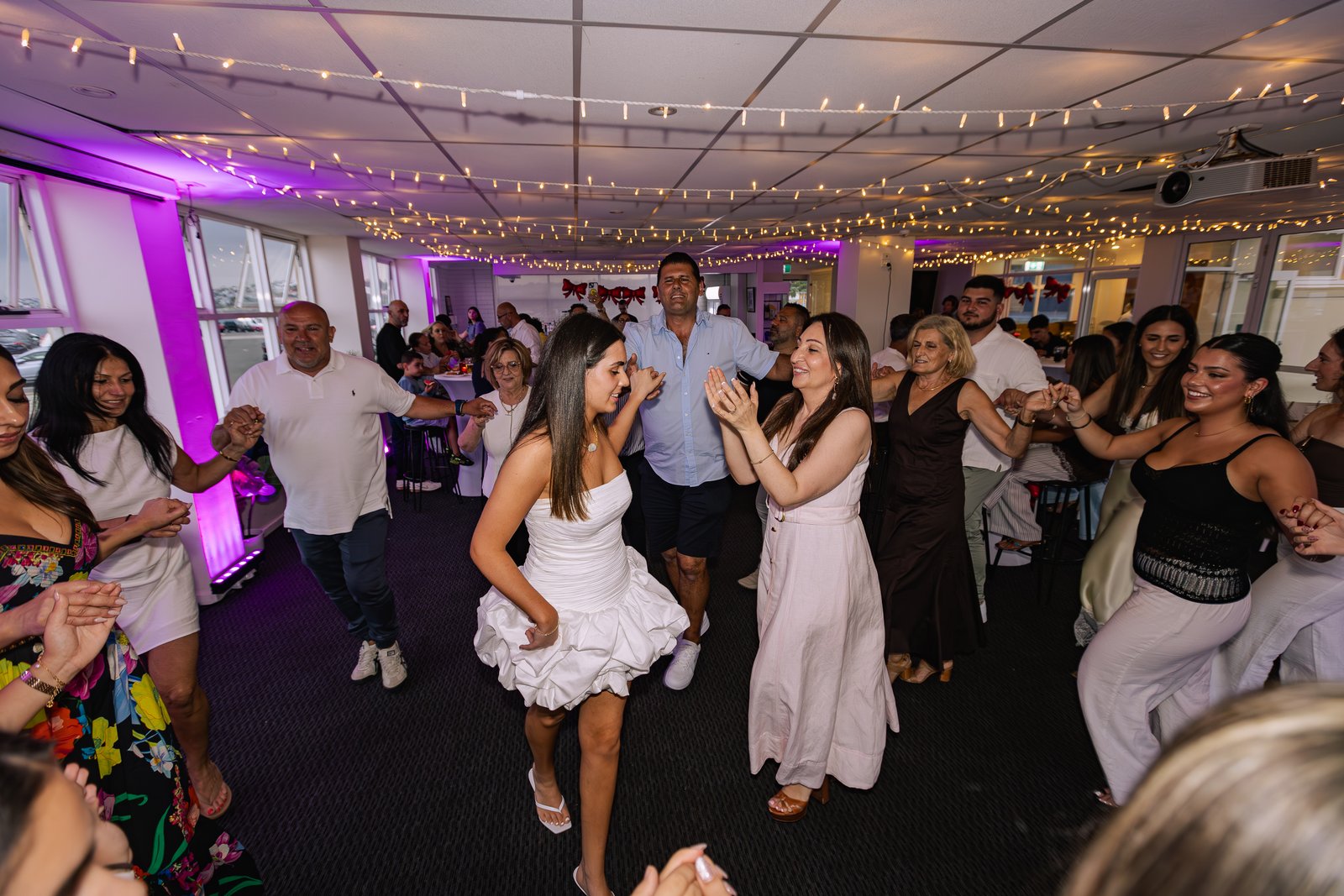 Party photographer capturing candid moments at a Sydney event